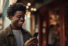 How to Maximize BangCasino Promotions: Boosting Your Winning Potential a man on a phone all jolly after knowing how to boost betting potential